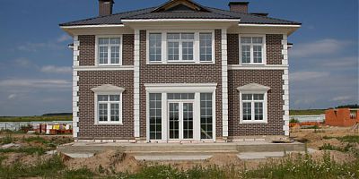 Фасад коттеджа с термопанелями Feldhaus