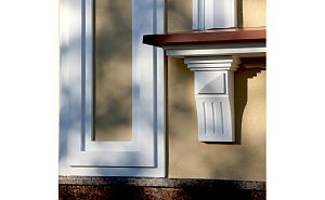 Консоли из полиуретана в обрамлении окна